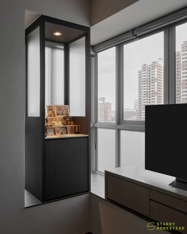 This space is designed for both entertainment and prayer, where the altar is enclosed with matte glass doors and black accents, creating a sense of solemnity and refined elegance.

Instead of LED strip lighting, the use of downlights enhances the presentation of the altar, giving it a more distinguished and dignified presence.
-
The Metropolitan // Modern Contemporary
Designer: Aaron
-
#starryhomestead #singapore #renovation #interiordesign #qanvast #homematch #hometrust #sghomedecor #singaporeinteriordesign #interiordesigninspo #sginterior #sgreno #sgid #sghome #hdbdesign #btodesign #condodesign #landed #commercial #modern #comtemporary #oriental #altar